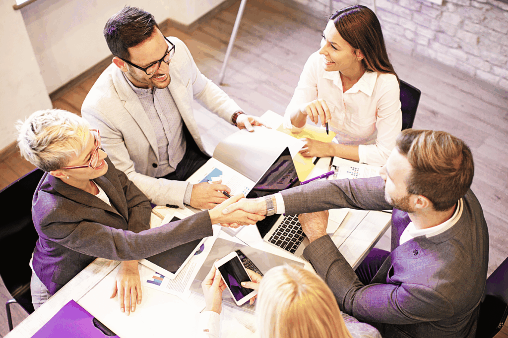 Post Bid Review Workshop – Bid Fusion Team gathered around a table participating in a post bid review workshop facilitated by Bid Fusion